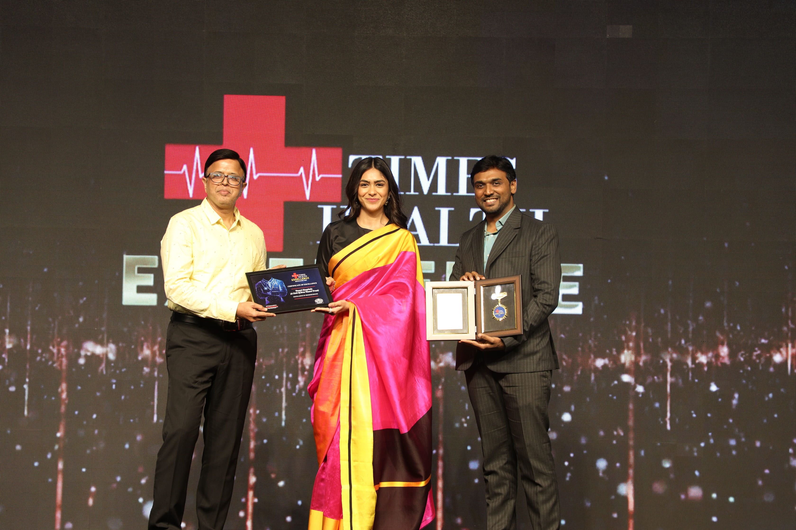 Doctors from Vasavi Hospitals Bangalore posing with trophies and certificates at the Times Health Excellence Awards.