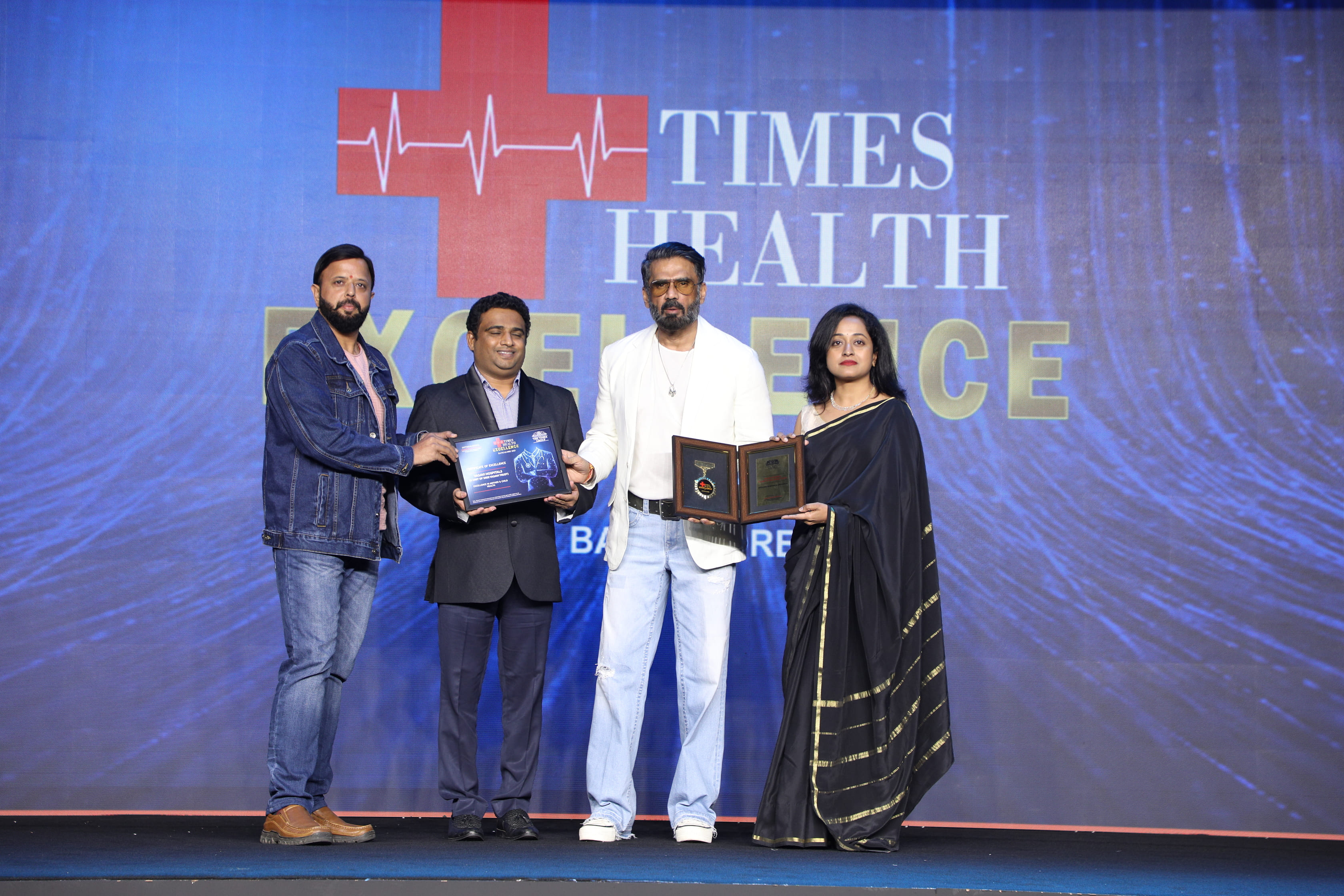 Vasavi Hospitals Bangalore receiving the Times Health Excellence Award for outstanding healthcare services.