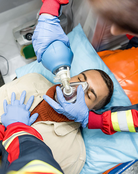 Ambulance emergency patient care at Vasavi Hospitals with life-saving oxygen and immediate treatment.