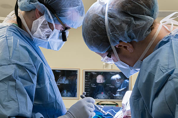 Neurosurgeons performing complex brain surgery in advanced operation theater