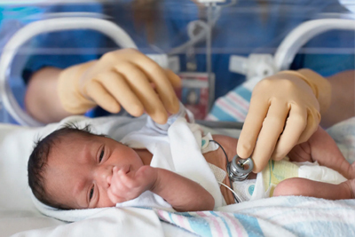  Premature baby receiving NICU care with stethoscope monitoring at Vasavi Hospitals Bangalore.