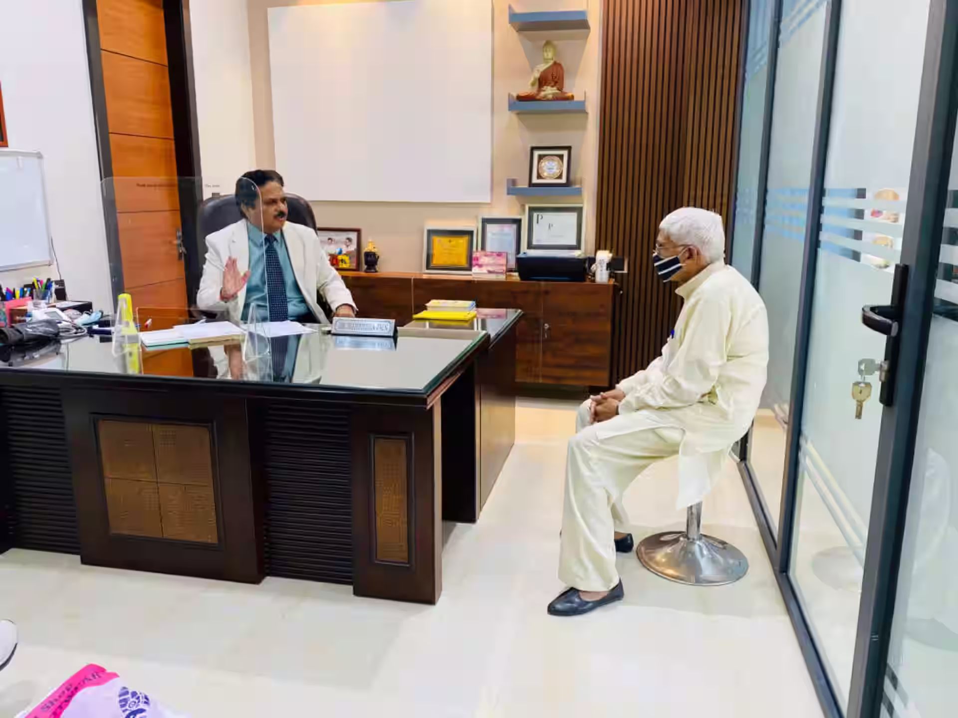 Psychiatrist consulting elderly patient in Bangalore clinic