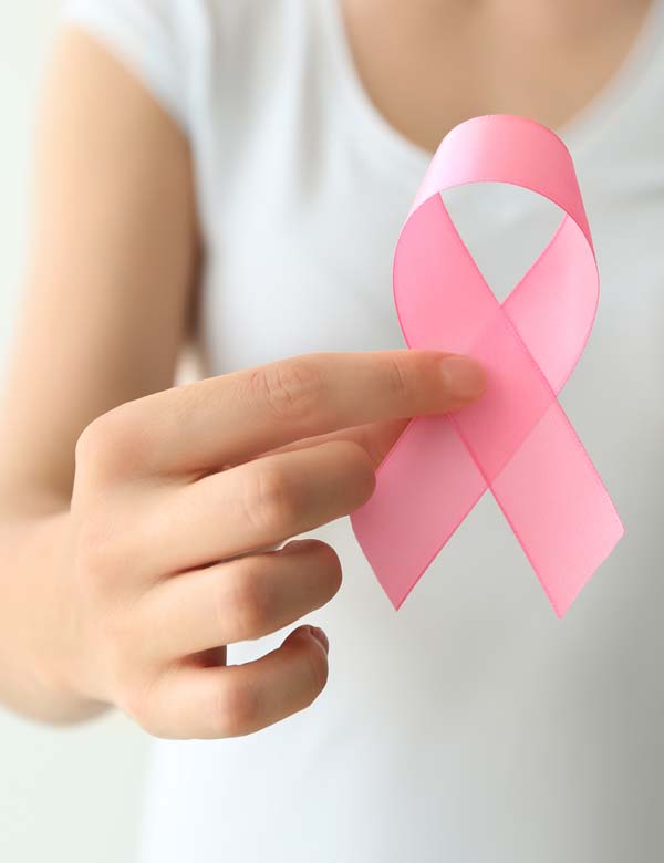 Pink ribbon symbolizing breast cancer awareness and surgical oncology care at Vasavi Hospitals Bangalore.