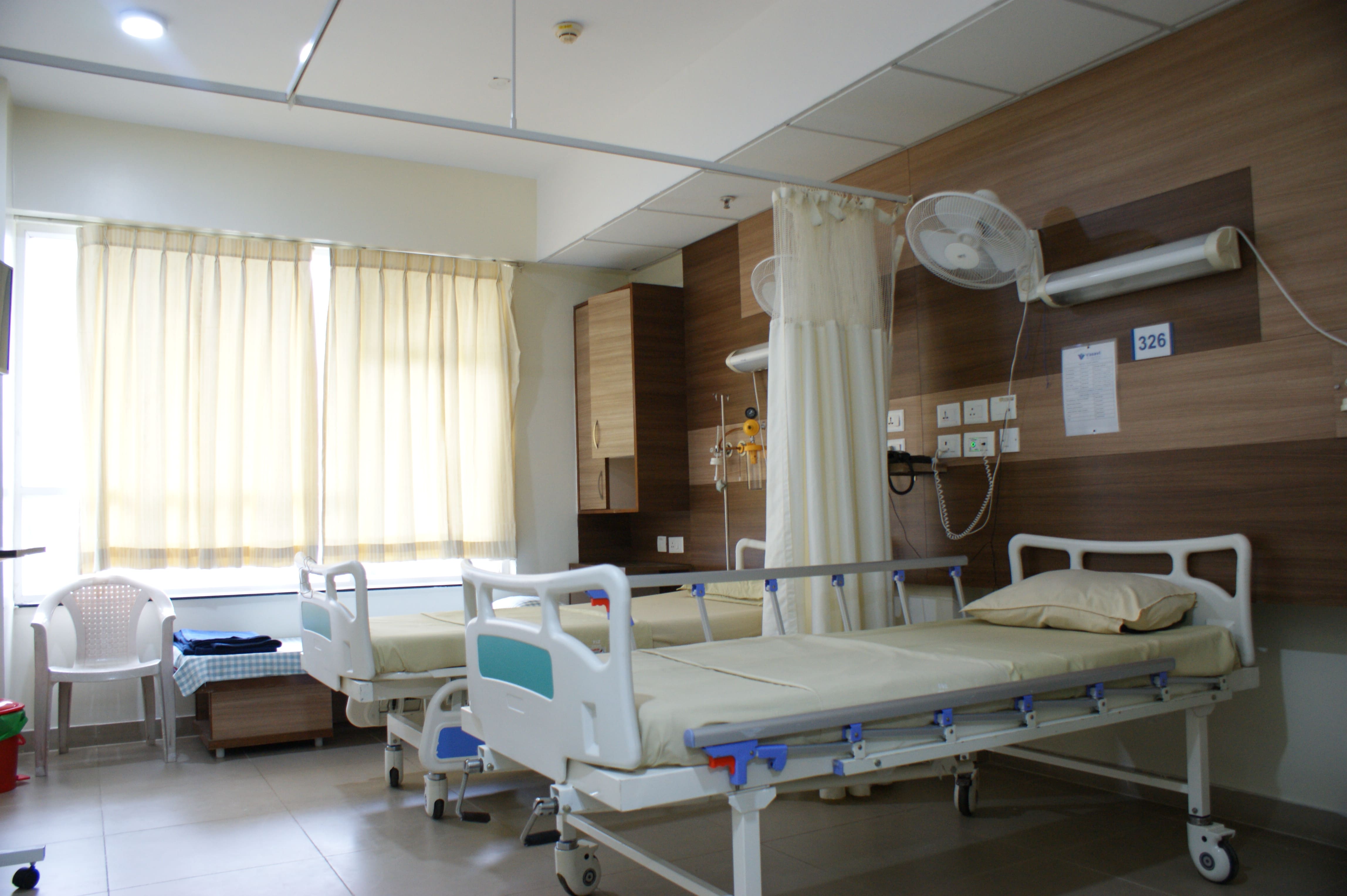 Modern patient room entrance at Vasavi Hospitals Bangalore designed for privacy and comfort.