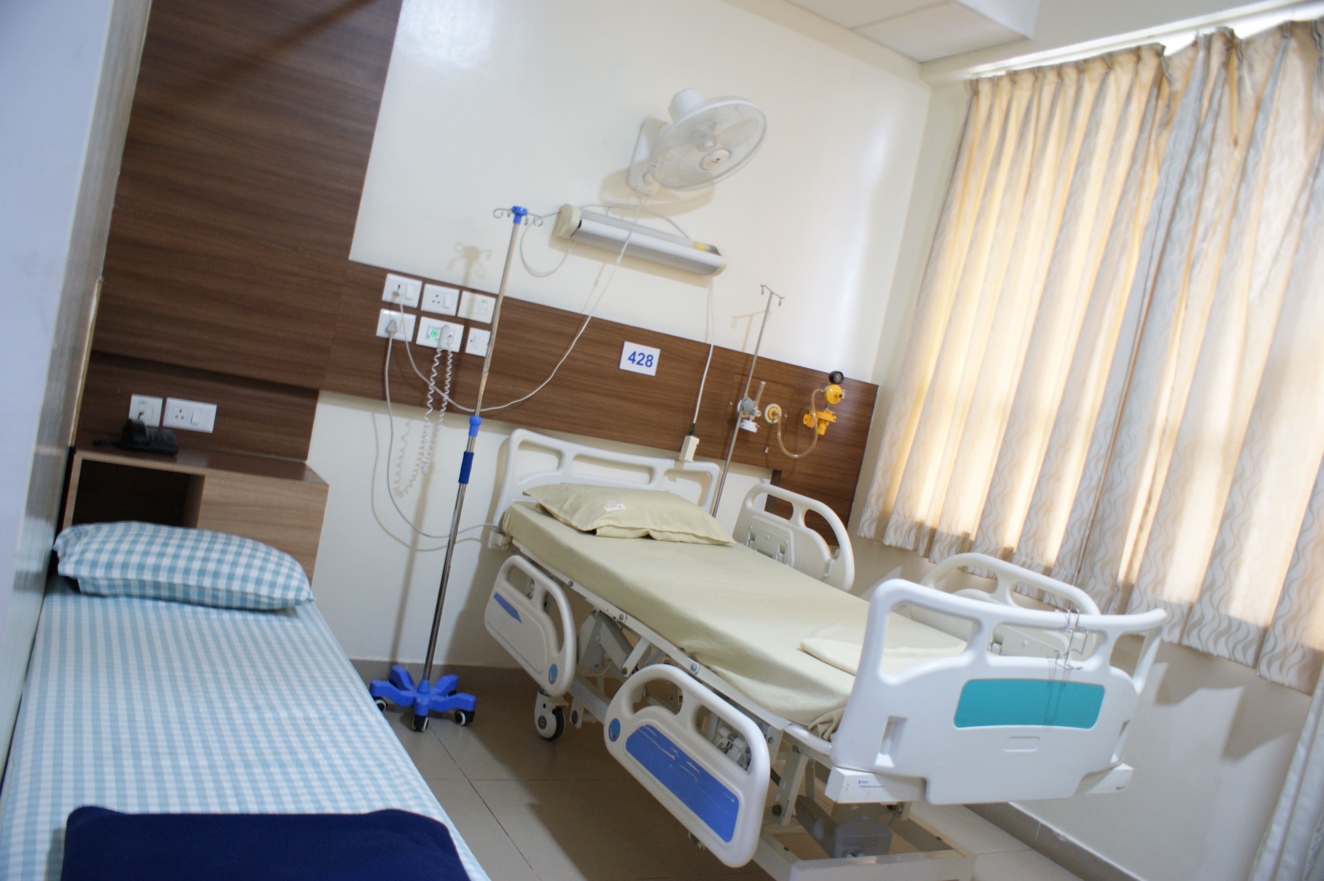 Private hospital room at Vasavi Hospitals Bangalore with attached amenities and patient care facilities.